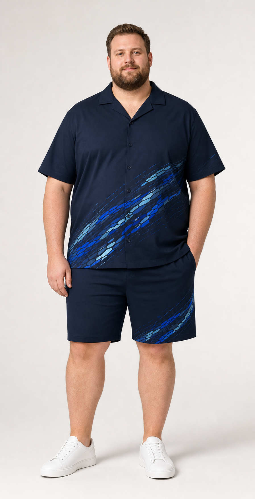 Big and tall man wearing the Glacier Current navy camp-collar shirt and matching shorts set, front view