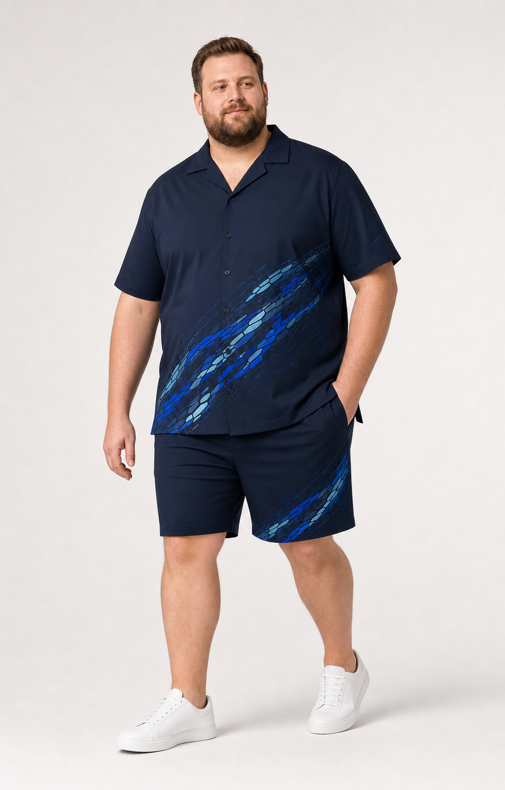 Big and tall man wearing the Glacier Current matching shirt and shorts set in a three-quarter stance