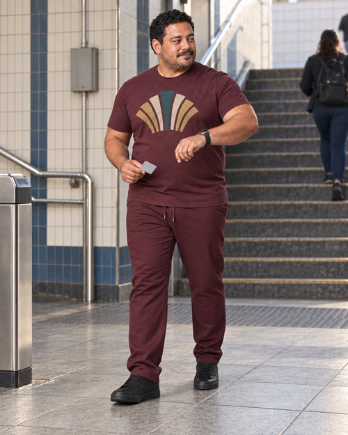 Burgundy Brass Fanrail outfit worn at an ordinary tiled transit entrance