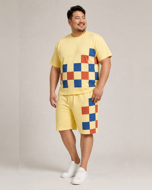 Big and tall man wearing the Butter Cobalt Checker Relay t-shirt and matching shorts set, full-body product view
