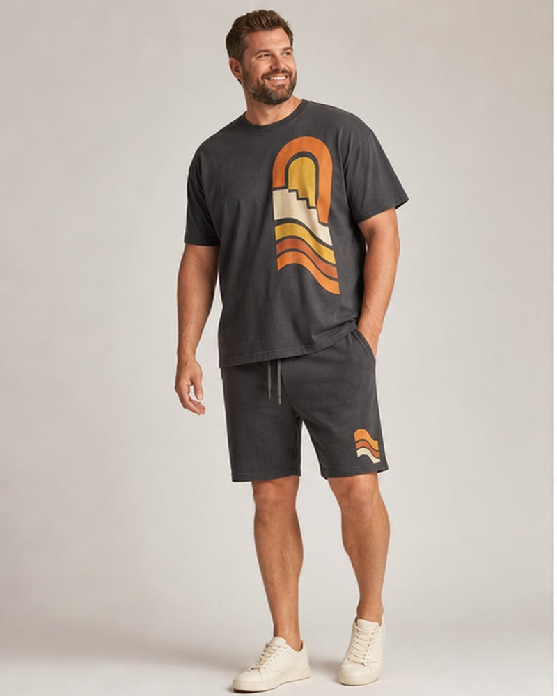 Big and tall man wearing the Canyon Sun Relay t-shirt and matching shorts set, clean full-body studio view