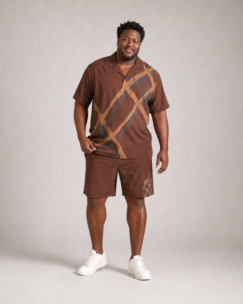Big and tall man wearing the Cedar Cane Shadow pocket-free camp shirt and matching shorts set, full-body studio view