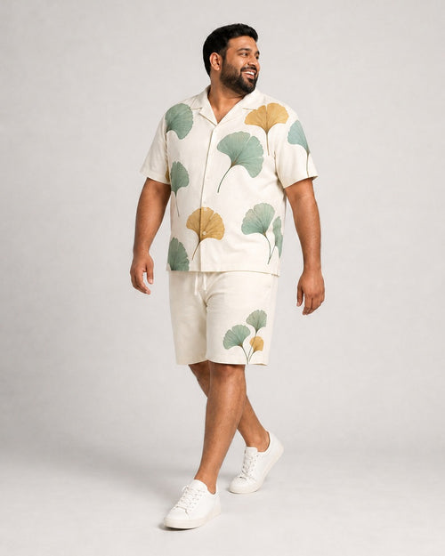 Big and tall man wearing the Celadon Ginkgo Scatter pocket-free shirt and matching shorts set, full-body product view