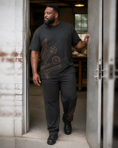 Big and tall man styling the Charcoal Ember Workbench t-shirt and matching pants set in a natural lifestyle scene
