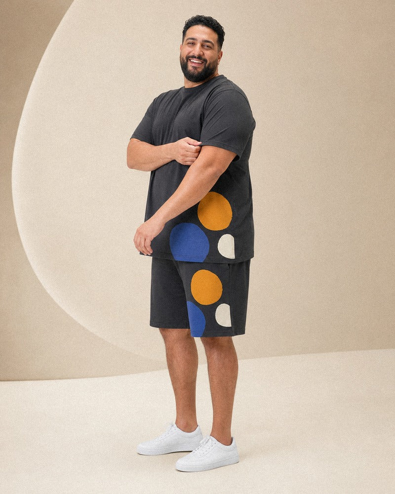 Big and tall man wearing the Charcoal Kinetic Dot t-shirt and shorts set, full-body product view