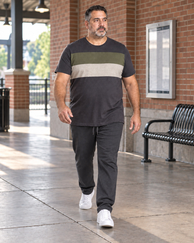 Charcoal Olive Block Relay outfit worn at an ordinary brick transit concourse