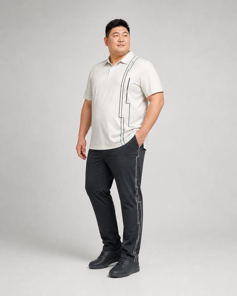 Big and tall man wearing the Cloudline Frame off-white polo and graphite pants set, front three-quarter view