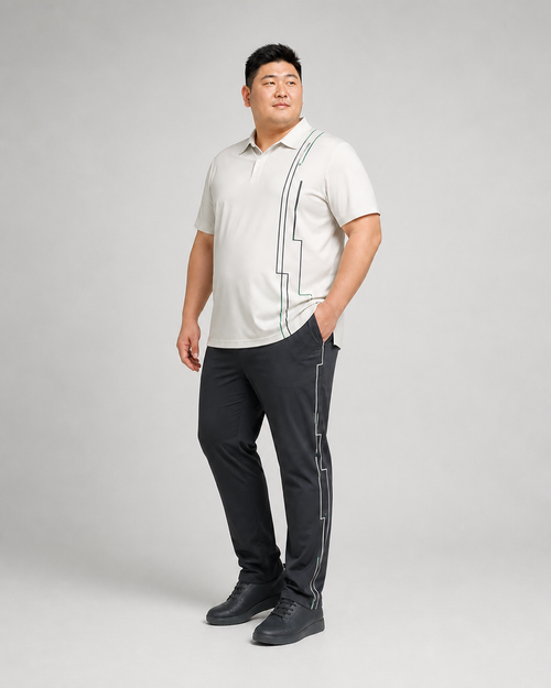 Big and tall man wearing the Cloudline Frame off-white polo and graphite pants set, front three-quarter view