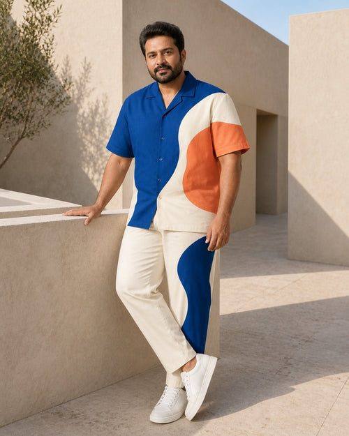 Big and tall man styling the Cobalt Terrace Cut pocket-free shirt and matching pants set in a lifestyle scene