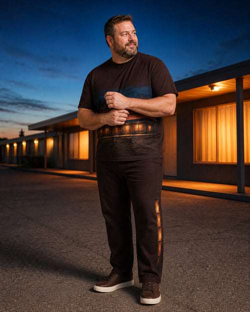 Big and tall man styling the Cocoa Motel Glow t-shirt and matching pants set in a lifestyle scene