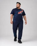Big and tall man wearing the Deep Current Koi T-shirt and matching pants set, clean full-body studio view