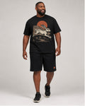 Big and tall man wearing the Dust Mesa Jackrabbit t-shirt and matching shorts set, clean full-body studio view