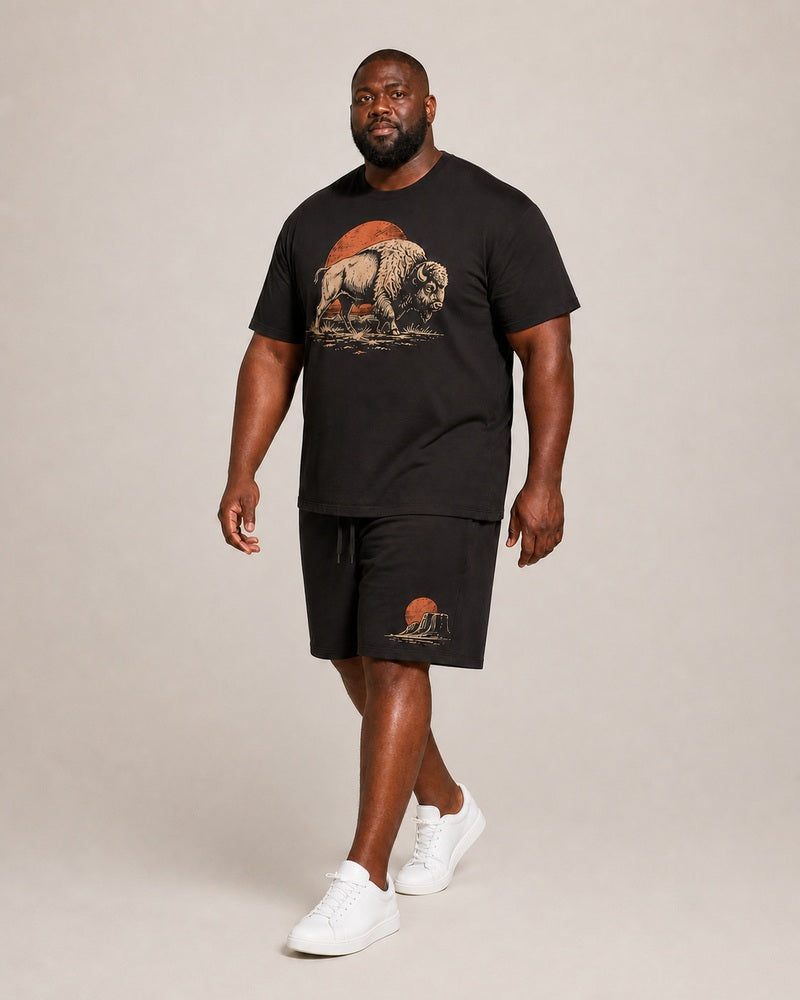 Big and tall man wearing the Dustland Bison T-shirt and matching shorts set, clean full-body studio view