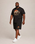 Big and tall man wearing the Dustland Bison T-shirt and matching shorts set, clean full-body studio view