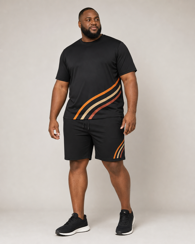 Big and tall man wearing the Ember Turnline T-shirt and matching shorts set, full-body front three-quarter studio view