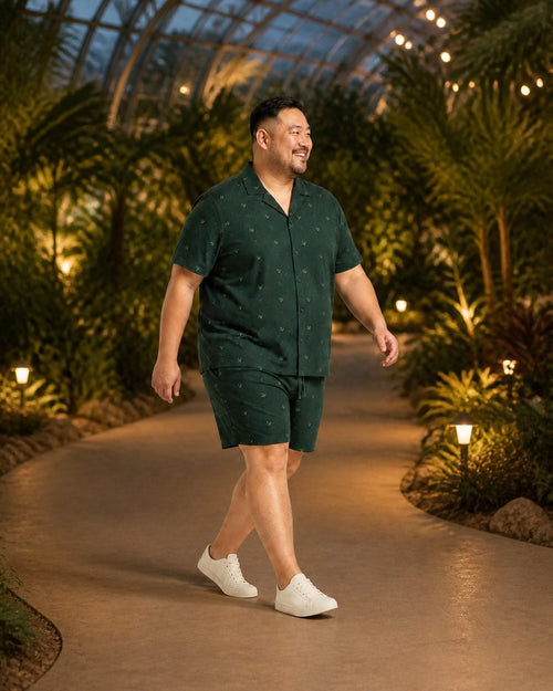 Big and tall man styling the Forest Firefly Canopy pocket-free shirt and matching shorts set in a lifestyle scene