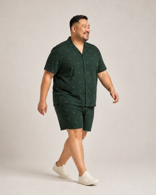 Big and tall man wearing the Forest Firefly Canopy pocket-free shirt and matching shorts set, full-body product view
