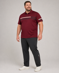 Big and tall man wearing the Garnet Barline polo shirt and matching pants set, full-body front three-quarter studio view