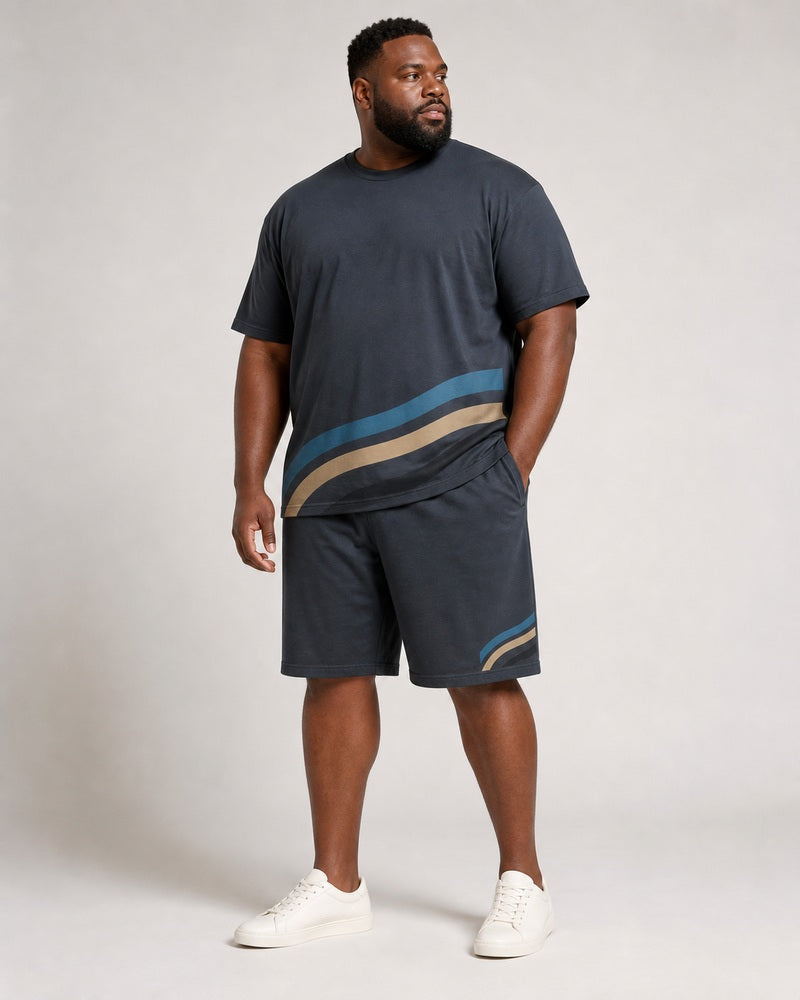 Big and tall man wearing the Granite Crosstide T-shirt and matching shorts set, full-body front three-quarter studio view
