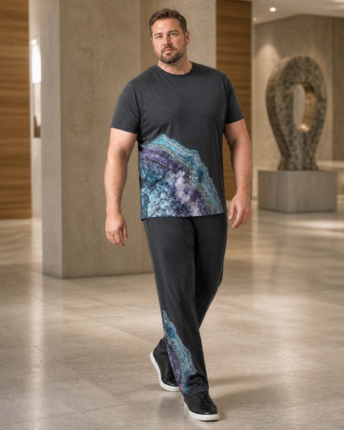 Big and tall man styling the Graphite Mineral Bloom t-shirt and matching pants set in a lifestyle scene