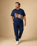 Big and tall man wearing the Indigo Accordion Signal t-shirt and matching pants set, full-body product view