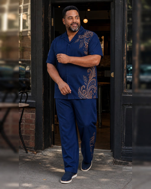 Big and tall man styling the Indigo Copper Mesa Paisley pocket-free shirt and matching pants set in a natural lifestyle scene