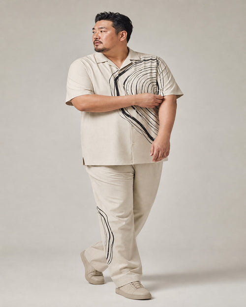 Big and tall man wearing the Ink Whorl Study pocket-free shirt and matching pants set, full-body product view
