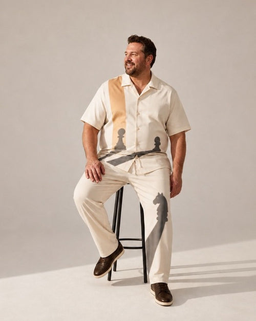 Big and tall man wearing the Ivory Chesslight pocket-free shirt and matching pants set, full-body product view