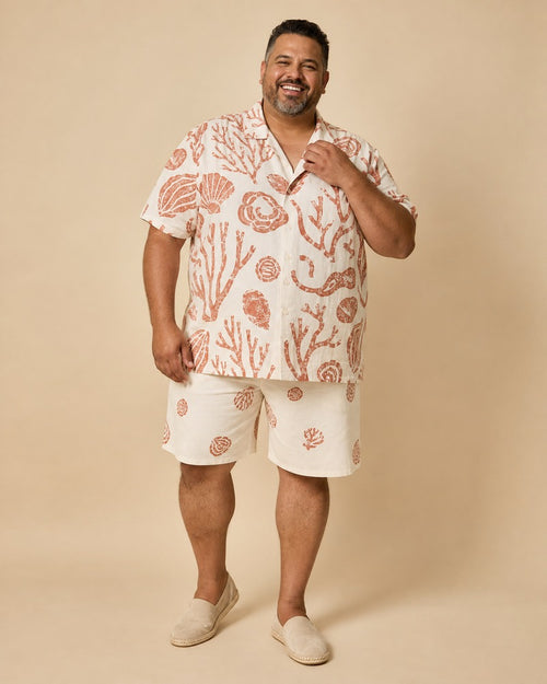 Big and tall man wearing the Ivory Tidecut pocket-free shirt and matching shorts set, full-body product view