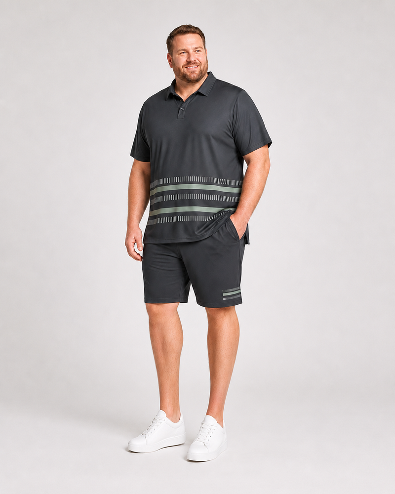 Big and tall man wearing the Jade Interval charcoal polo and matching shorts set, front three-quarter view