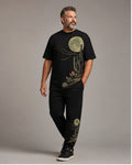 Big and tall man wearing the Lunar Cactus Drift t-shirt and matching pants set, clean full-body studio view
