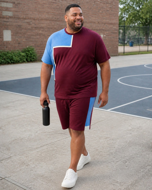 Big and tall man styling the Merlot Sky Courtline t-shirt and matching shorts set in a natural lifestyle scene