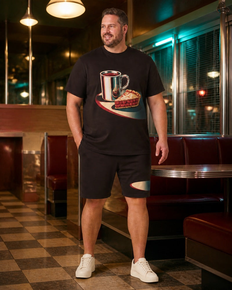 Big and tall man styling the Midnight Diner Still t-shirt and matching shorts set in a natural lifestyle scene