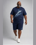 Big and tall man wearing the Midnight Marlin Wake t-shirt and matching shorts set, clean full-body studio view