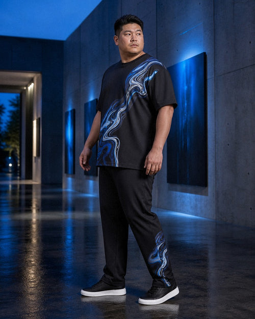 Big and tall man styling the Molten Lake Signal t-shirt and matching pants set in a natural lifestyle scene