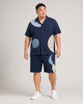 Big and tall man wearing the Moonlit Cadence short-sleeve shirt and matching shorts set, full-body front three-quarter studio view