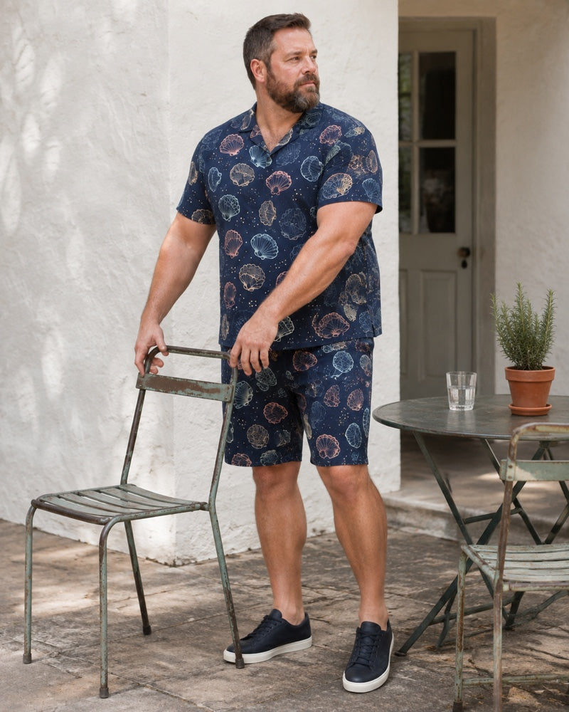 Navy Guava Shell Ledger outfit worn in an ordinary outdoor cafe courtyard