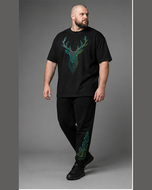 Big and tall man wearing the Neon Stag Circuit t-shirt and matching pants set, clean full-body studio view
