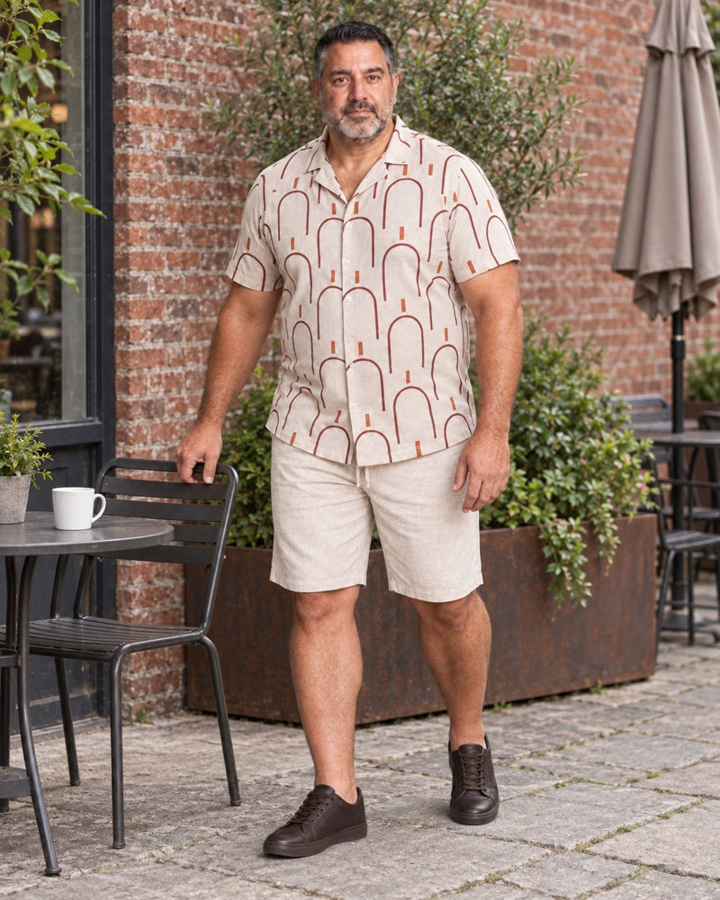 Oatmeal Burgundy Archway Tiles outfit worn at an ordinary neighborhood cafe courtyard with a metal chair, small plain table, worn brick wall and planter box