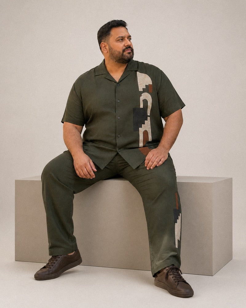 Big and tall man wearing the Olive Glyph Terrace pocket-free shirt and matching pants set, full-body product view