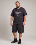Big and tall man wearing the Orbit Moth Atlas T-shirt and matching shorts set, clean full-body studio view