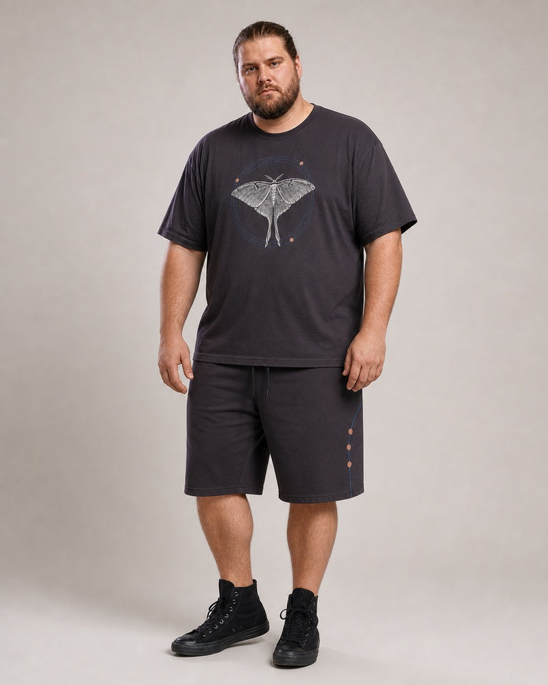 Big and tall man wearing the Orbit Moth Atlas T-shirt and matching shorts set, clean full-body studio view