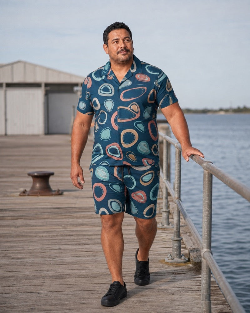 Petrol Coral Tidepool Stones outfit on a public pier walkway