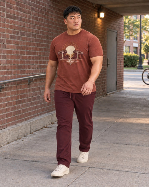 Rust Oat Transit Halo outfit worn in an ordinary brick pedestrian underpass