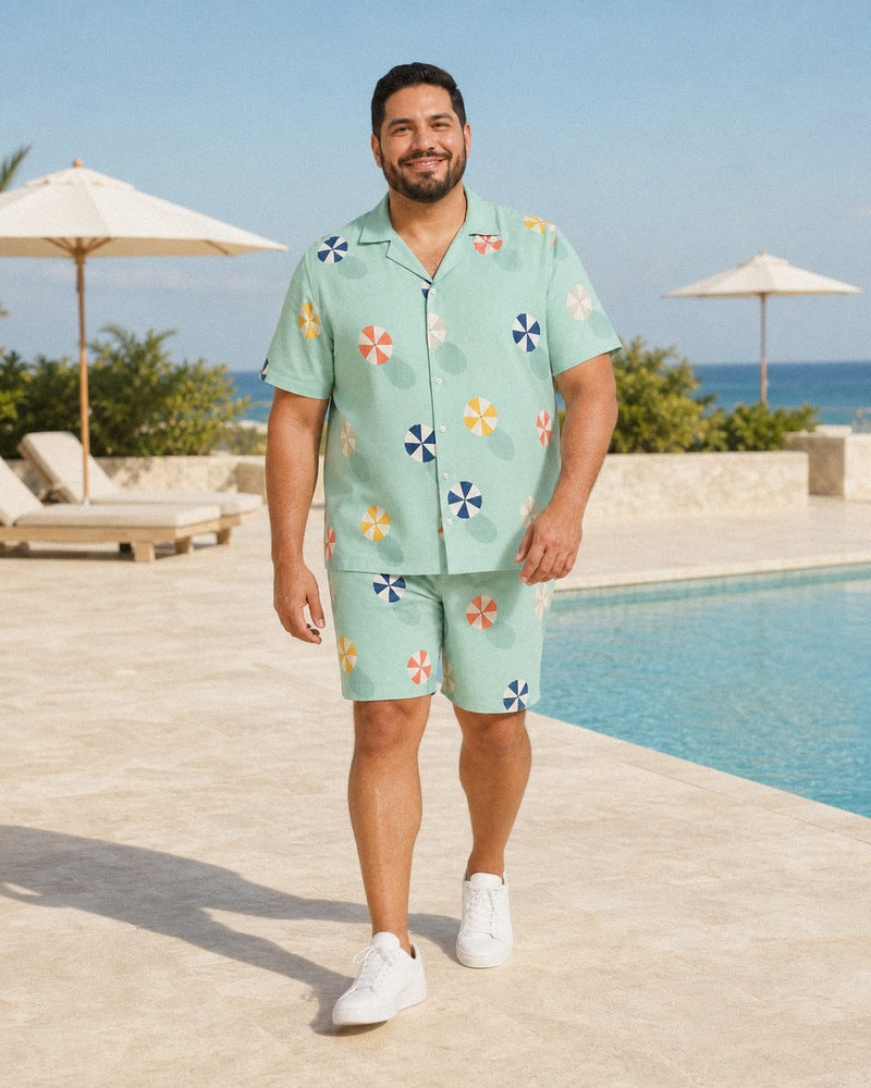 Big and tall man styling the Seafoam Parasol Scatter pocket-free shirt and matching shorts set in a natural lifestyle scene