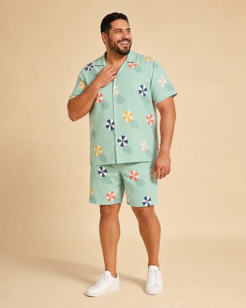 Big and tall man wearing the Seafoam Parasol Scatter pocket-free shirt and matching shorts set, full-body product view