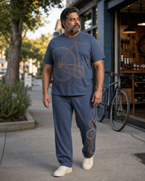 Big and tall man styling the Slate Rust Bicycle Works t-shirt and matching pants set in a natural lifestyle scene
