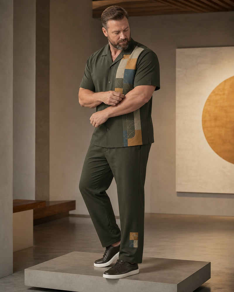 Big and tall man wearing the Solstice Patchwork matching set in a modern architectural setting