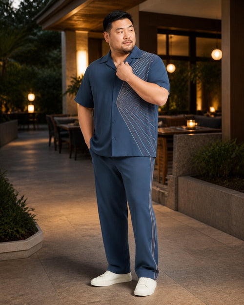 Big and tall man styling the Steel Pinstripe Pivot pocket-free shirt and matching pants set in a lifestyle scene