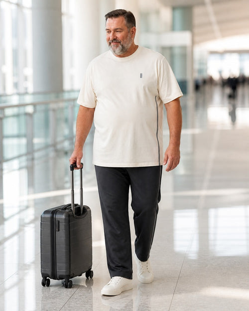 Big and tall man styling the Stone Quiet Marker t-shirt and matching pants set in a lifestyle scene